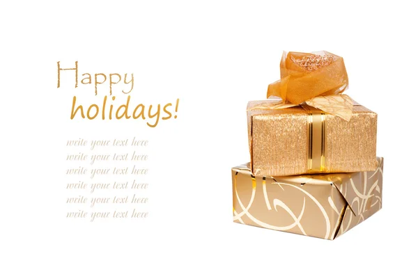 Beautiful gift boxes in gold paper — Stock Photo, Image