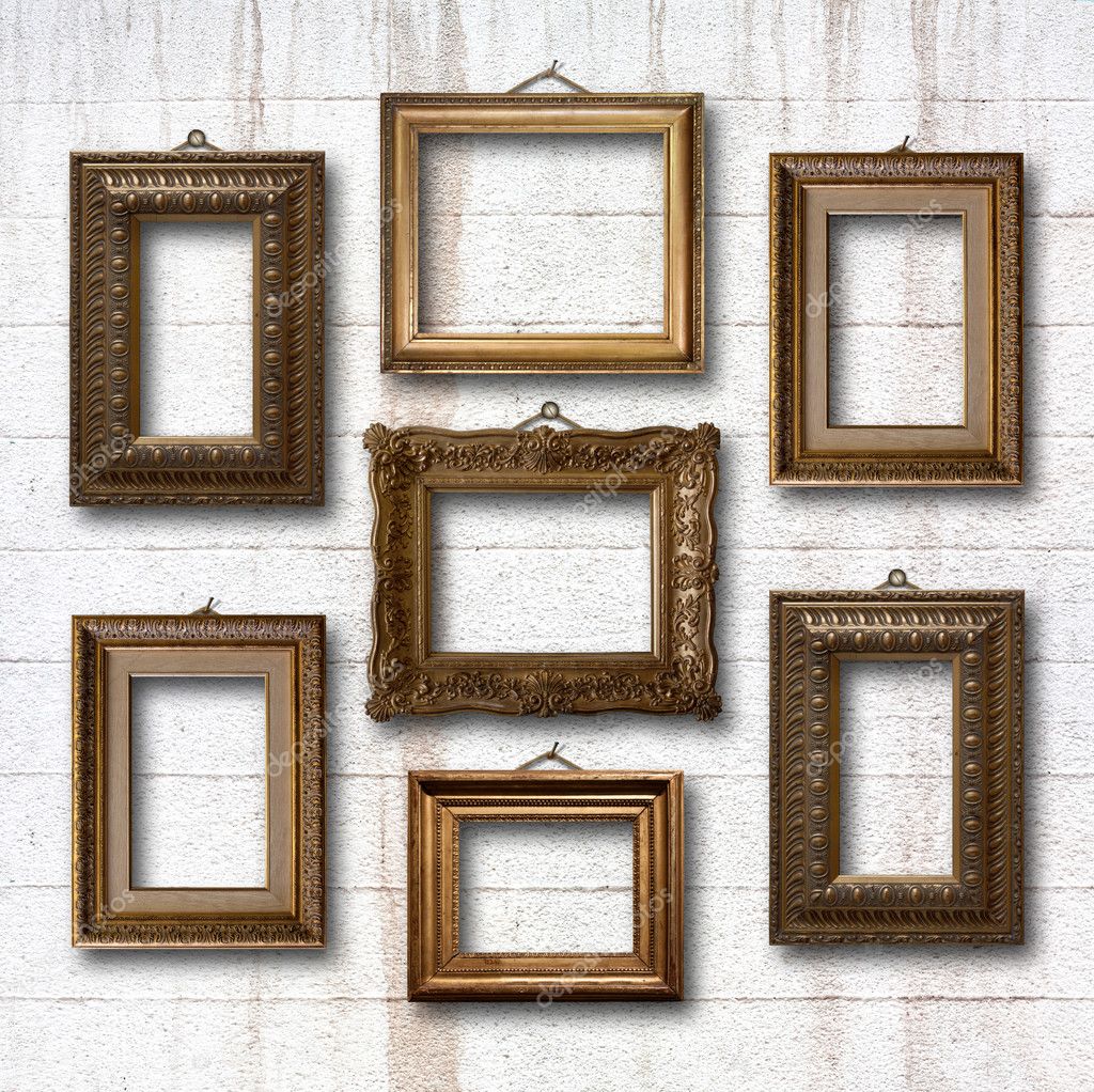Gilded wooden frames on old stone wall