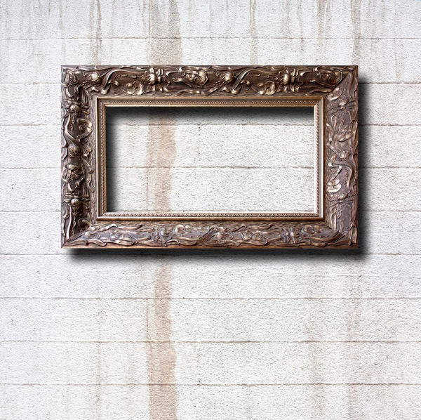 Gilded wooden frames for pictures on old stone wall — Stock Photo, Image