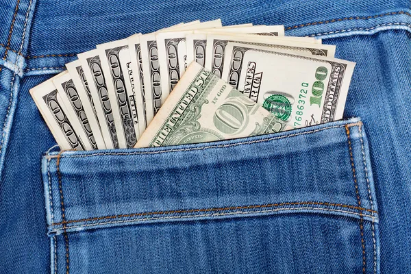 A hundred dollar bills sticking in the back pocket of denim blue — Stock Photo, Image