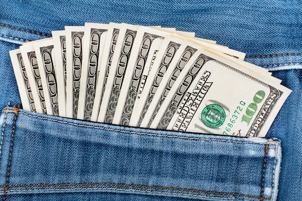 A hundred dollar bills sticking in the back pocket of denim blue — Stock Photo, Image