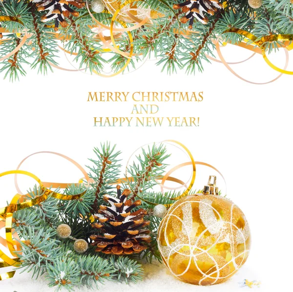 Christmas tree branch with gold serpentine and yellow sphere on — Stock Photo, Image