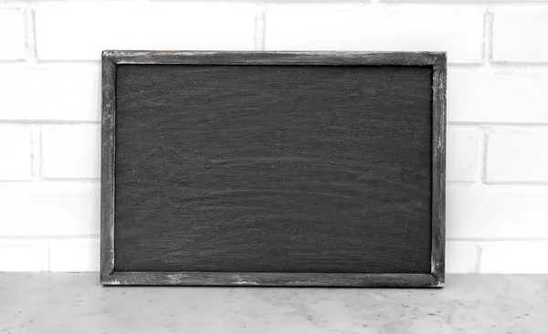 Mockup art of vintage chalkboard background texture with old vintage wooden frame, image for work about design element concept.