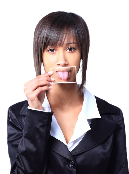 Girl holding a card with photo her tongue in front of her mouth — Stock Photo, Image