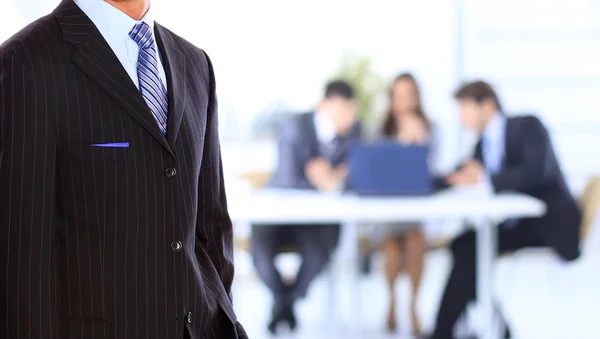 Business man standing in an office — Stock Photo, Image
