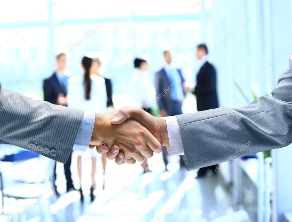 Close up of businessmen shaking hands