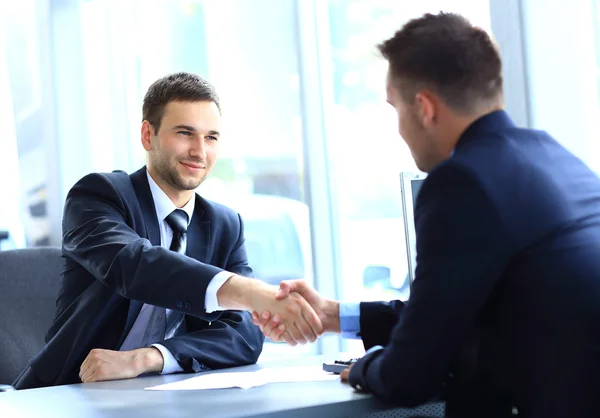 Businessman shaking hands to seal a deal with his partner — Stock Photo, Image
