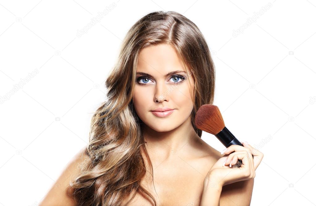 Beauty girl with makeup brushe