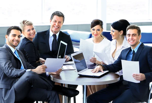 Group of happy business people in a meeting at office - Stock Image -  Everypixel