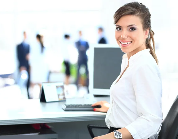 Business woman with team working on laptop Stock Image