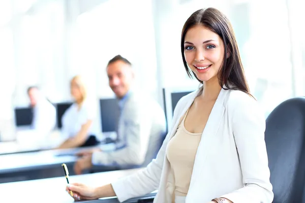 Business woman with her team at the office Stock Photo