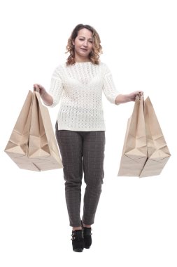 Alışveriş çantalı sıradan bir genç kadın. bir beyaz üzerinde izole