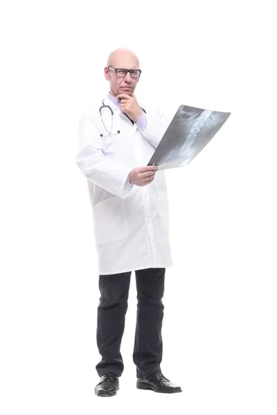 Senior doctor with a stethoscope looking at an x-ray. — Stock Photo, Image