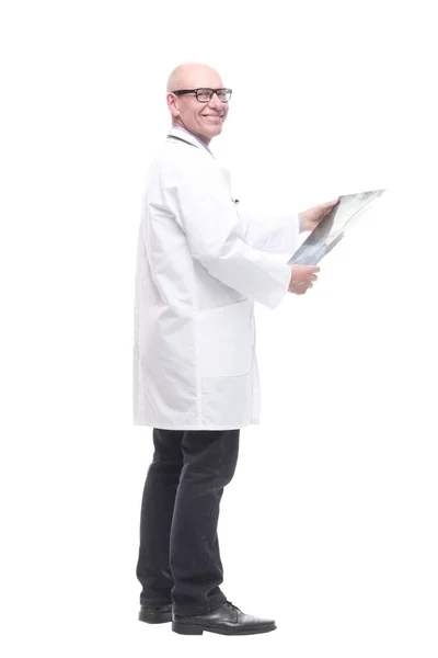 Senior doctor with a stethoscope looking at an x-ray. — Stock Photo, Image