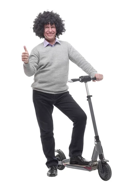 In volle groei. vrolijk man met een elektrische scooter. — Stockfoto