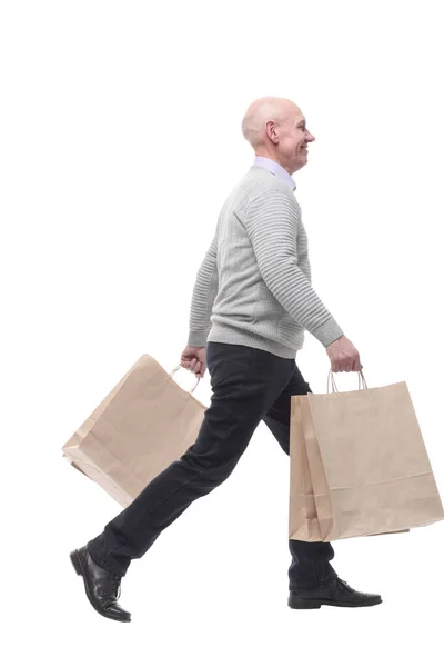 En pleine croissance. homme heureux avec des sacs à provisions. — Photo