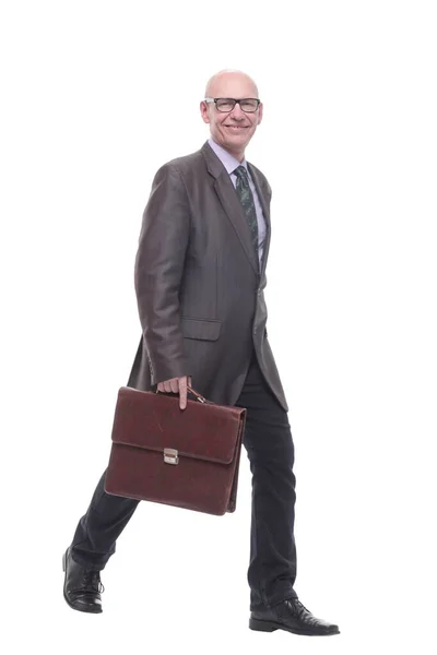Business man with a leather briefcase striding forward. Stock Image
