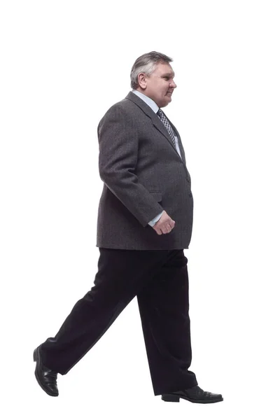 Business man confidently striding forward . isolated on a white — Stock Photo, Image