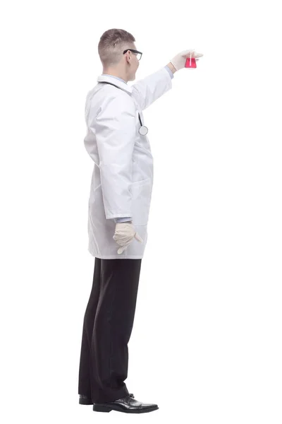 In full growth. smiling doctor with a laboratory flask. — Stock Photo, Image