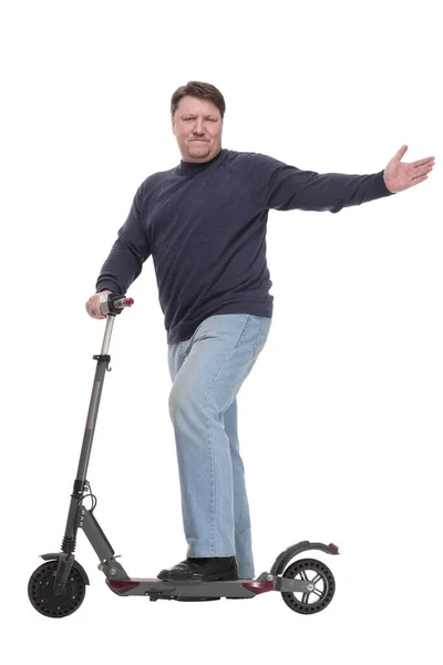 Comprimento total. homem maduro com uma scooter elétrica. — Fotografia de Stock