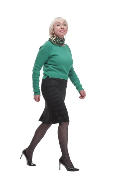 In full growth. woman in a green jumper striding forward. — Fotografia de Stock