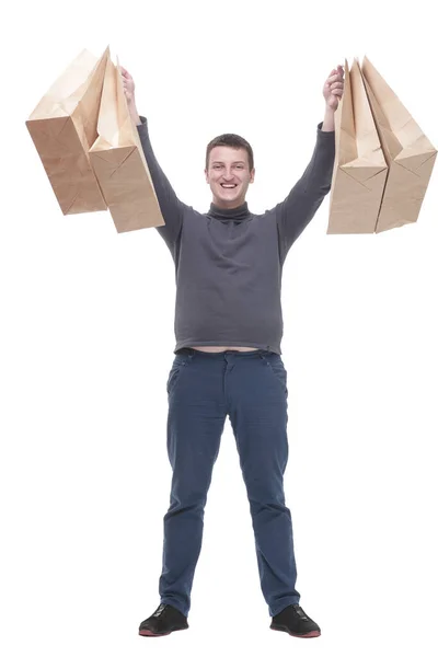 In full growth. casual young man with shopping bags. — стоковое фото