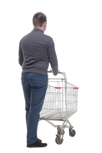 V plném růstu. ležérní mladý muž s nákupním vozíkem. — Stock fotografie