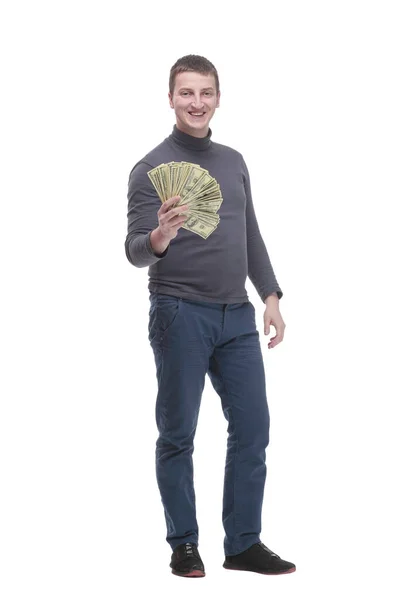 In full growth. casual young man with dollar bills. — стоковое фото