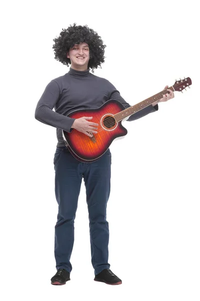 In full growth. curly-haired cheerful man with a guitar. — Stock Photo, Image