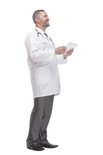 In full growth. smiling doctor with a digital tablet . Stock Image
