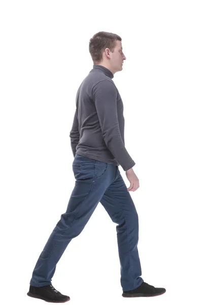 Young man in casual clothing striding forward. — Stockfoto