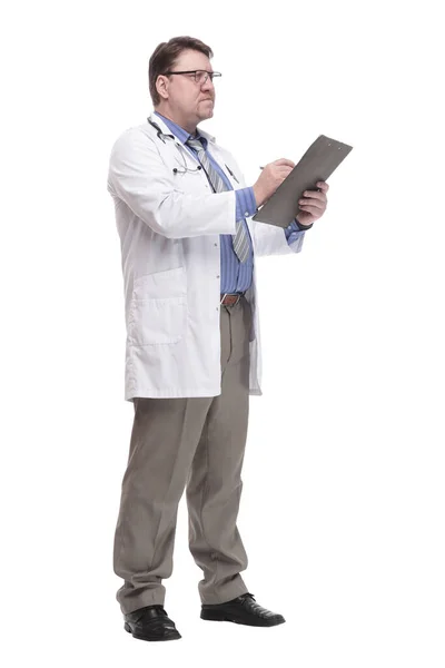 In full growth. qualified doctor with a clipboard. — Fotografia de Stock