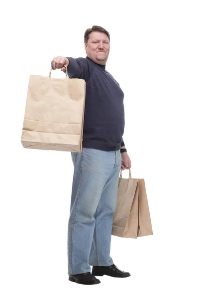 In vollem Wachstum. lässiger älterer Mann mit Einkaufstaschen . — Stockfoto