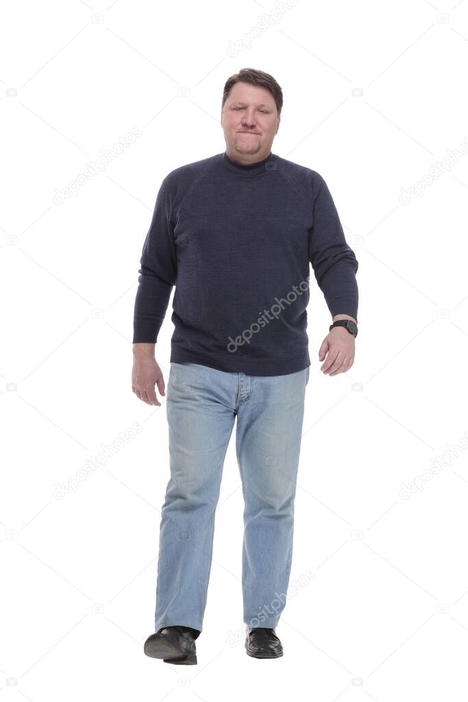 Mature man in jeans striding forward.isolated on a white background.
