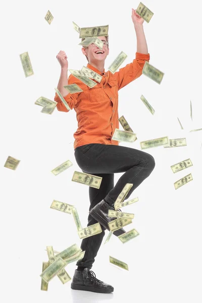 Ευτυχισμένος νεαρός που απολαμβάνει τη βροχή των χρημάτων, απομονωμένος στα λευκά — Φωτογραφία Αρχείου
