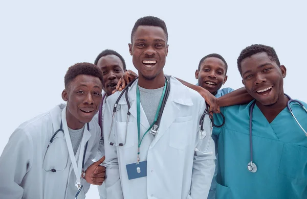 I full tillväxt. leende unga läkare står en efter en — Stockfoto