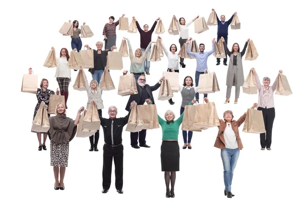 Skupina lidí provozuje papírové nákupní tašky — Stock fotografie