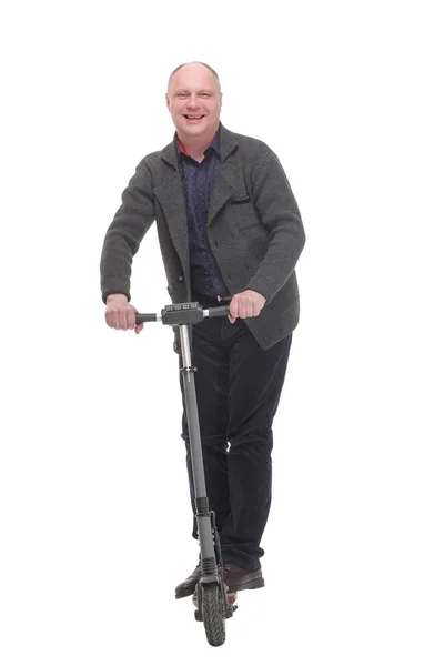 Szczęśliwy casual człowiek z elektrycznym skuterem .isolated na białym tle. — Zdjęcie stockowe