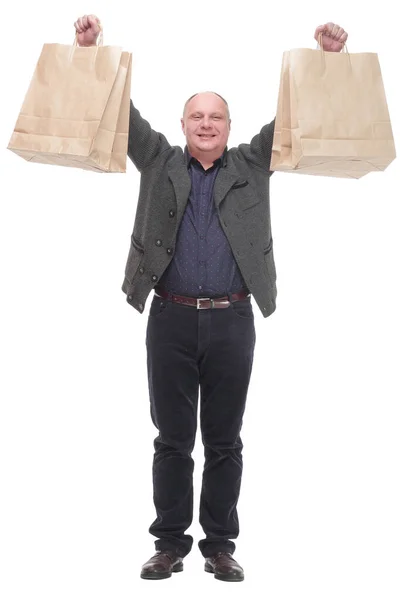 Homme décontracté joyeux avec des sacs à provisions .isolated sur un fond blanc. — Photo