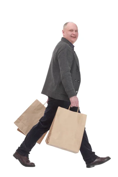 Allegro uomo casual con shopping bags .isolated su sfondo bianco. — Foto Stock