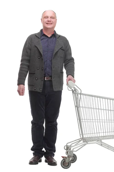 Lächelnder lässiger Mann mit Einkaufswagen. Isoliert auf weißem Hintergrund. — Stockfoto