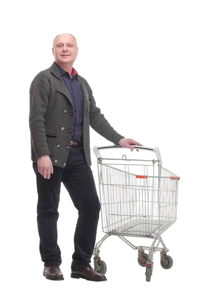 Sonriente hombre casual con carrito de la compra .isolated sobre un fondo blanco. — Foto de Stock