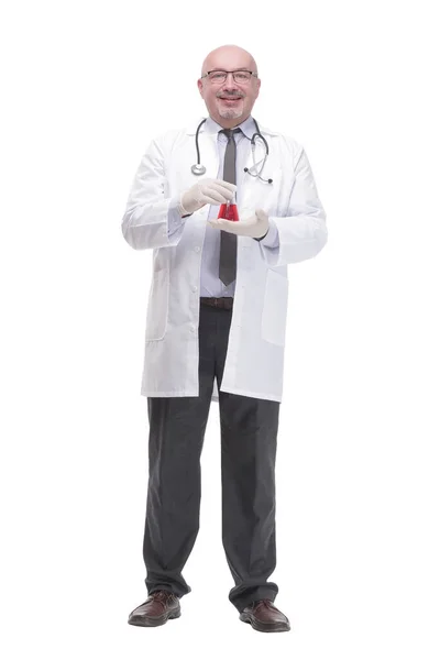 Mature doctor with a laboratory flask. isolated on a white background. — Zdjęcie stockowe