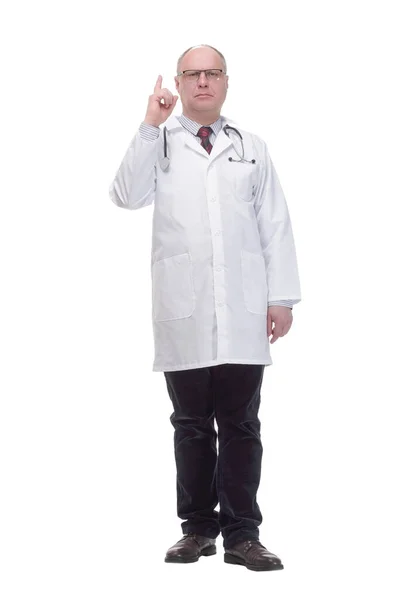 Full-length. mature doctor pointing the correct direction . — Stockfoto