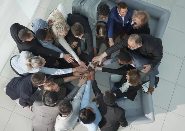 Diverse business people group put hands together in stack pile at training as concept of sales team corporate unity connection — Stock fotografie