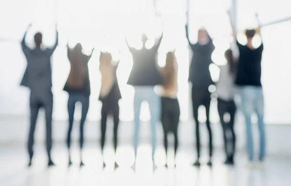 Rückansicht. Hintergrundbild einer Gruppe junger Geschäftsleute — Stockfoto