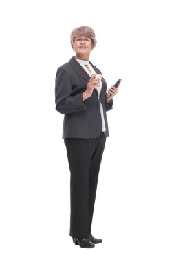 Portrait of a mature attractive stylish woman retired with a cup of coffee and a smartphone in her hand