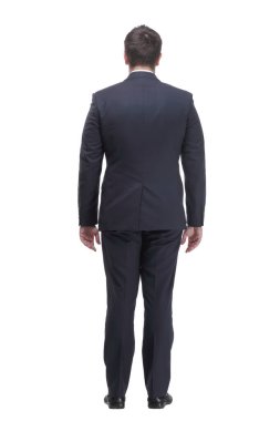 Full length portrait of businessman standing back and looking away