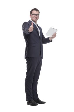 Side view portrait of curious and smiling businessman with tablet looking and pointing to side