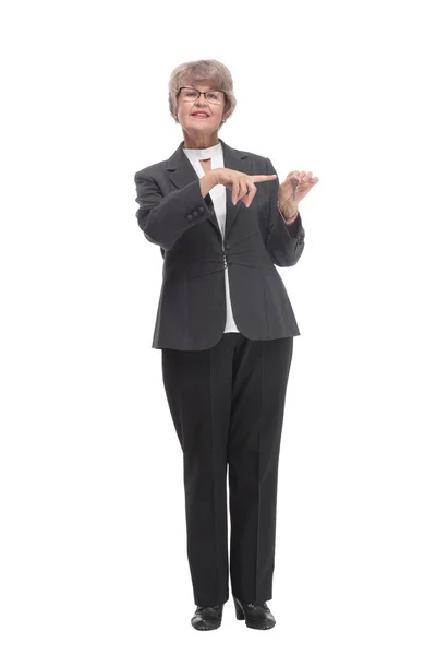 Happy mature woman with key on white background — Photo